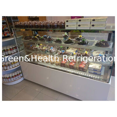 Expositor refrigerado de pasteles de esquina con múltiples estantes, de pie